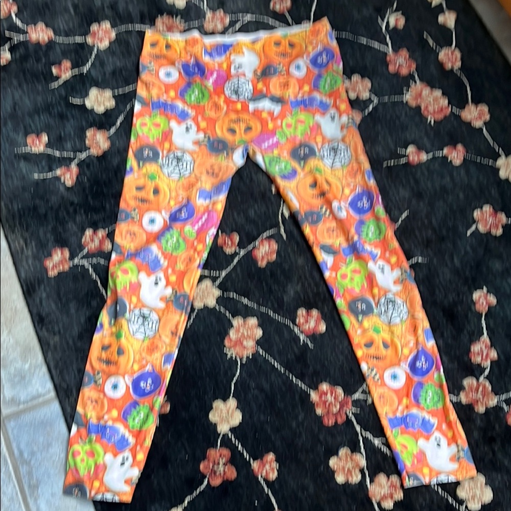 No Boundaries Orange and Black Leggings Vibrant Floral Design. Halloween motif.